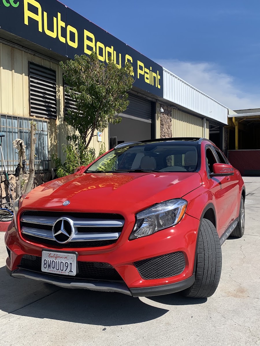 Red Mercedes-Benz GLA in front of the shop